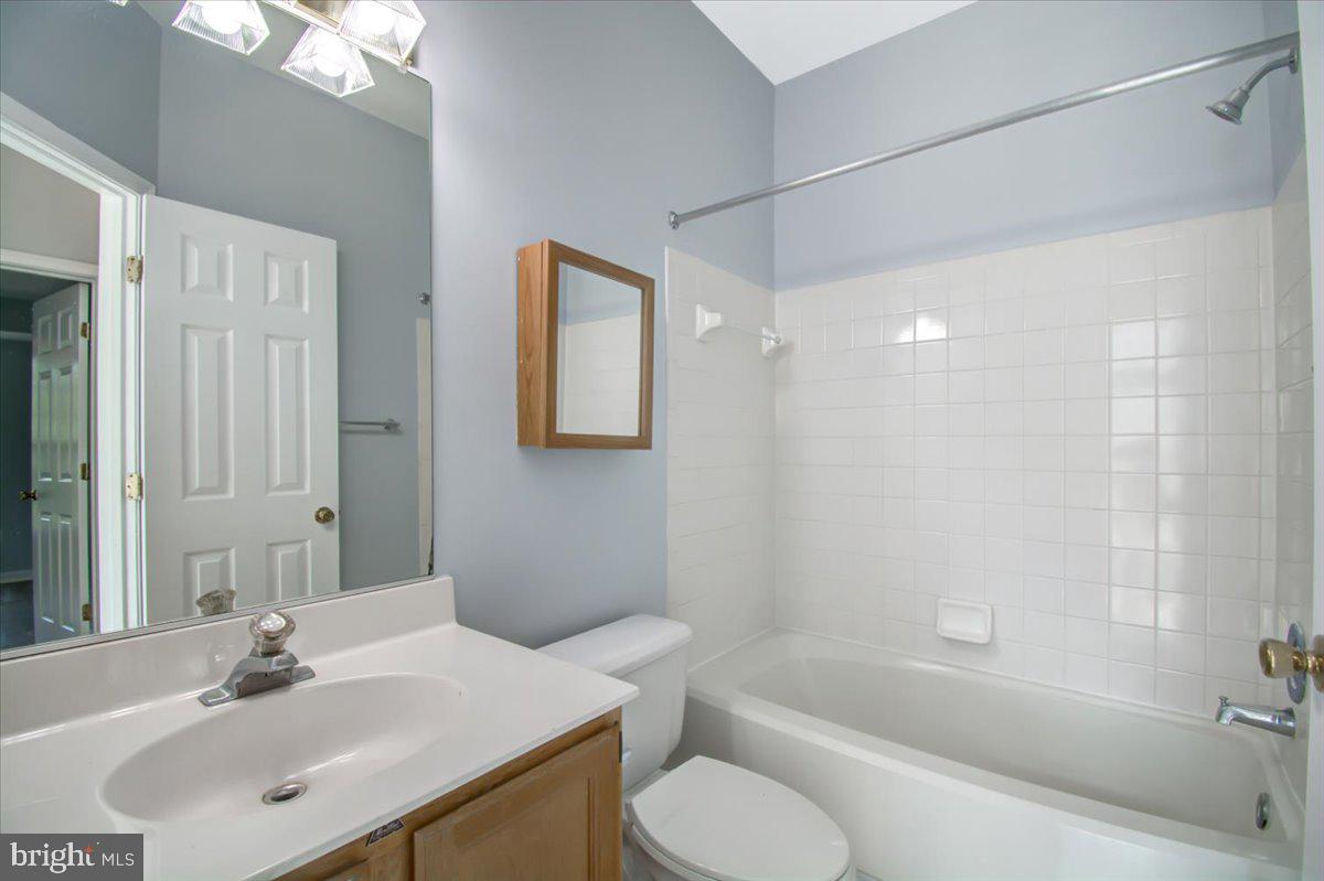 2207 Commissary Circle Odenton, MD 21113 - Photo 33 of 50 a bathroom with a sink toilet and shower
