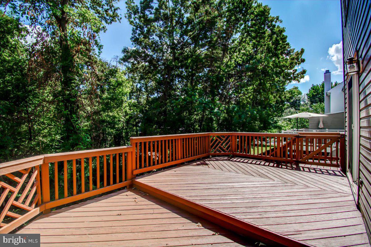 2207 Commissary Circle Odenton, MD 21113 - Photo 44 of 50 a view of balcony with wooden floor and fence