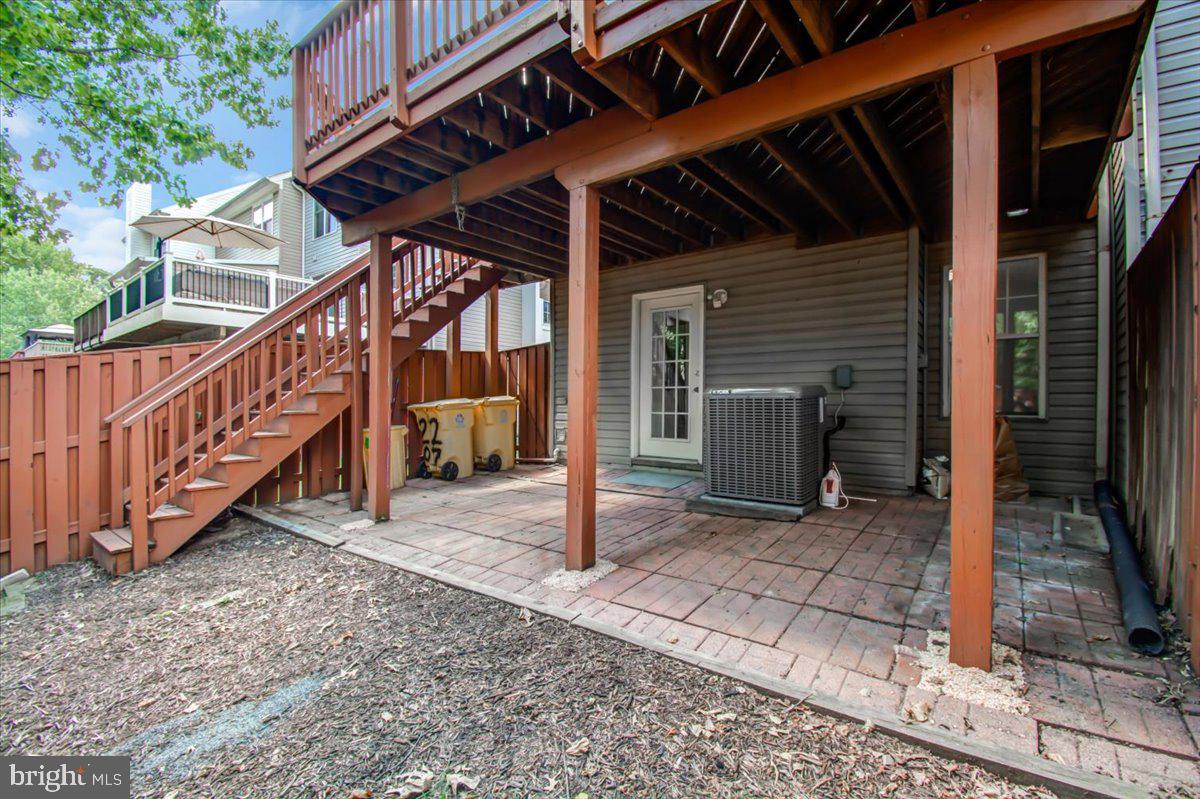 2207 Commissary Circle Odenton, MD 21113 - Photo 48 of 50 a view of a house with wooden deck and furniture