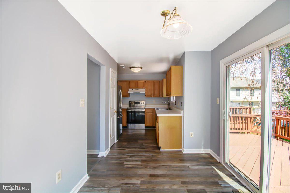 2207 Commissary Circle Odenton, MD 21113 - Photo 5 of 50 a view of a kitchen from the hallway