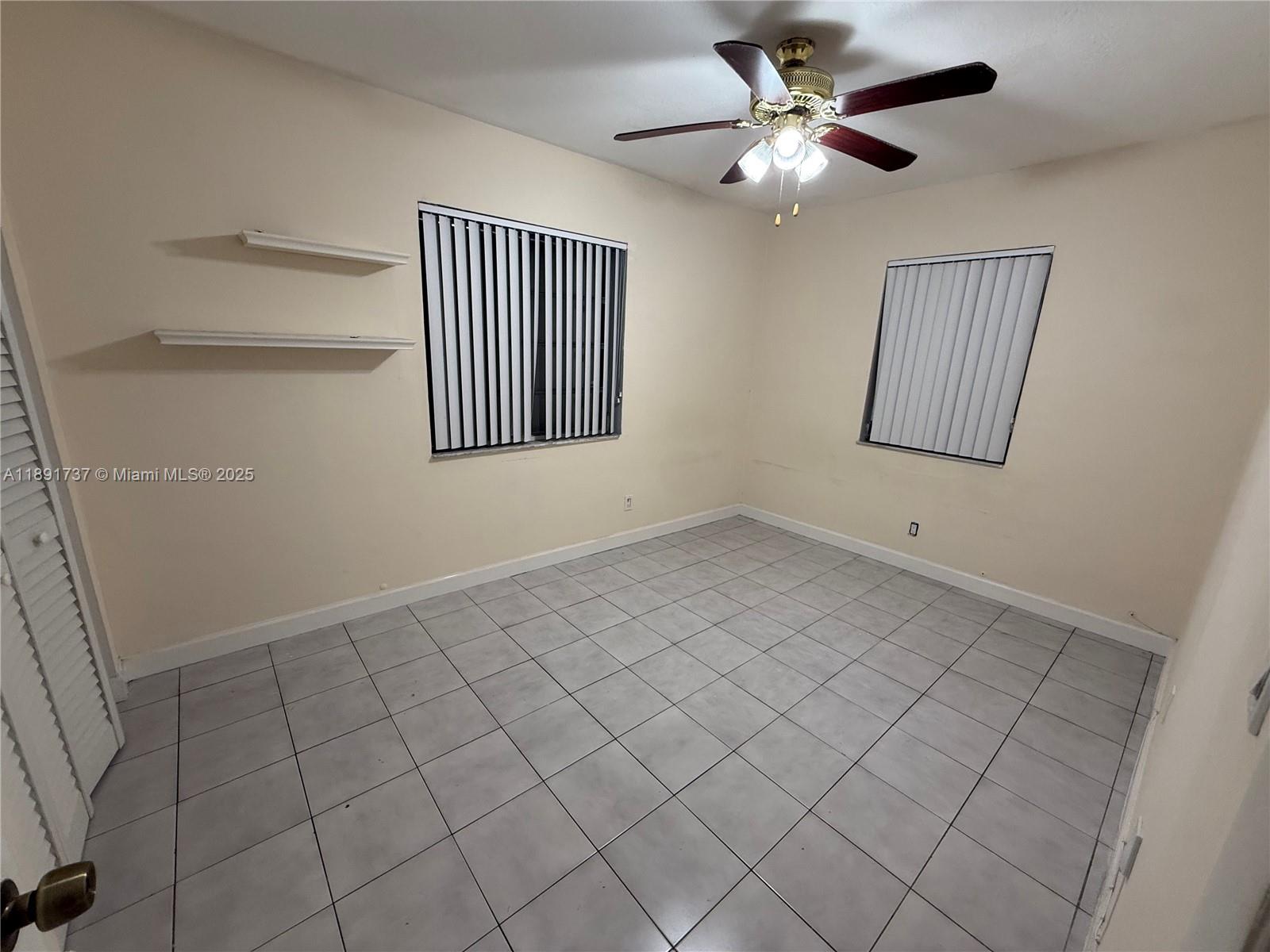 3450 Southwest 75th Court Miami, FL 33155 - Photo 16 of 22 a view of an empty room and window