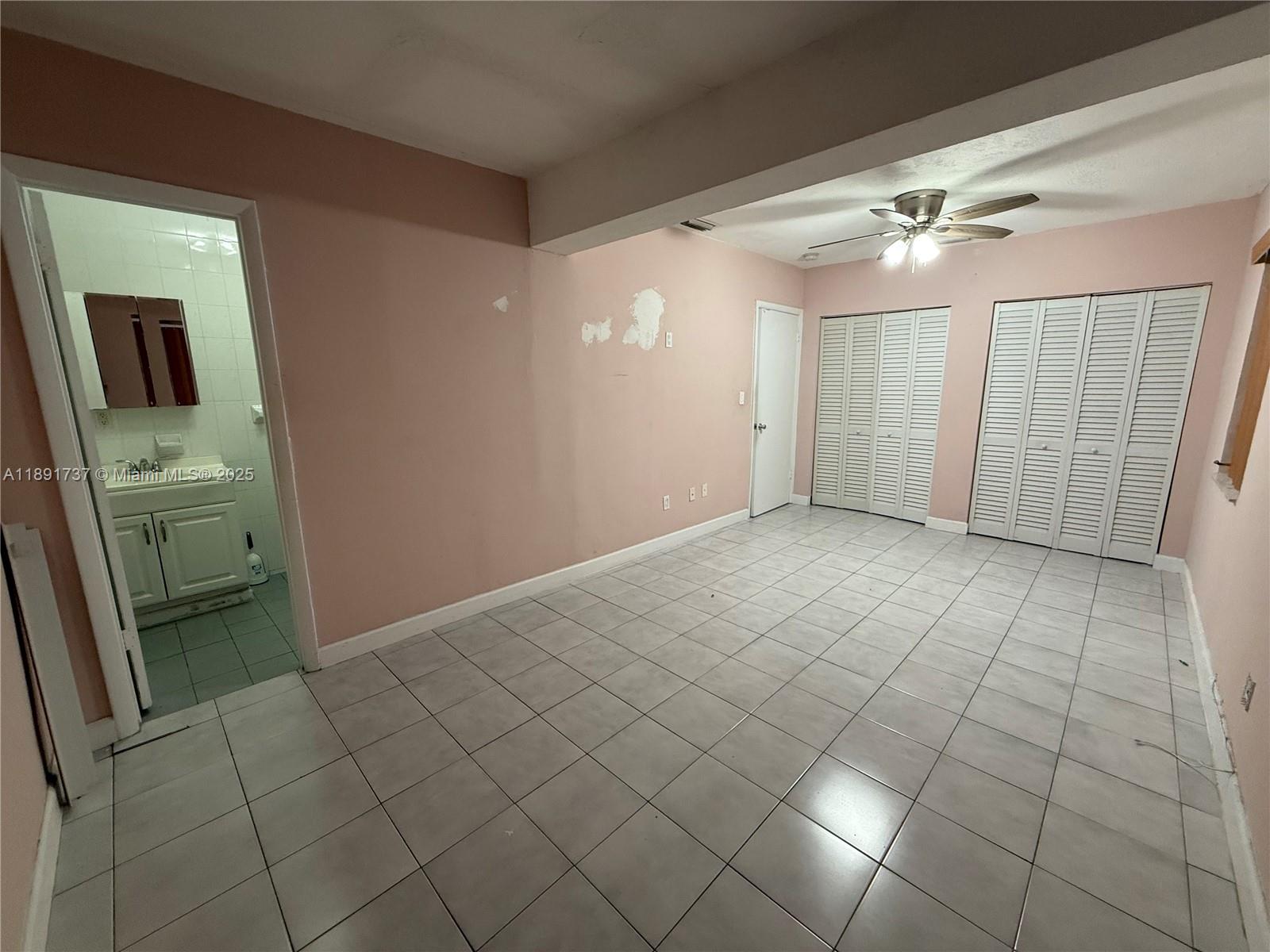 3450 Southwest 75th Court Miami, FL 33155 - Photo 17 of 22 a view of an empty room and a bathroom