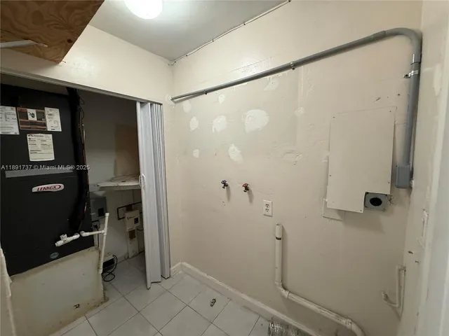 a bathroom with a shower and a glass door