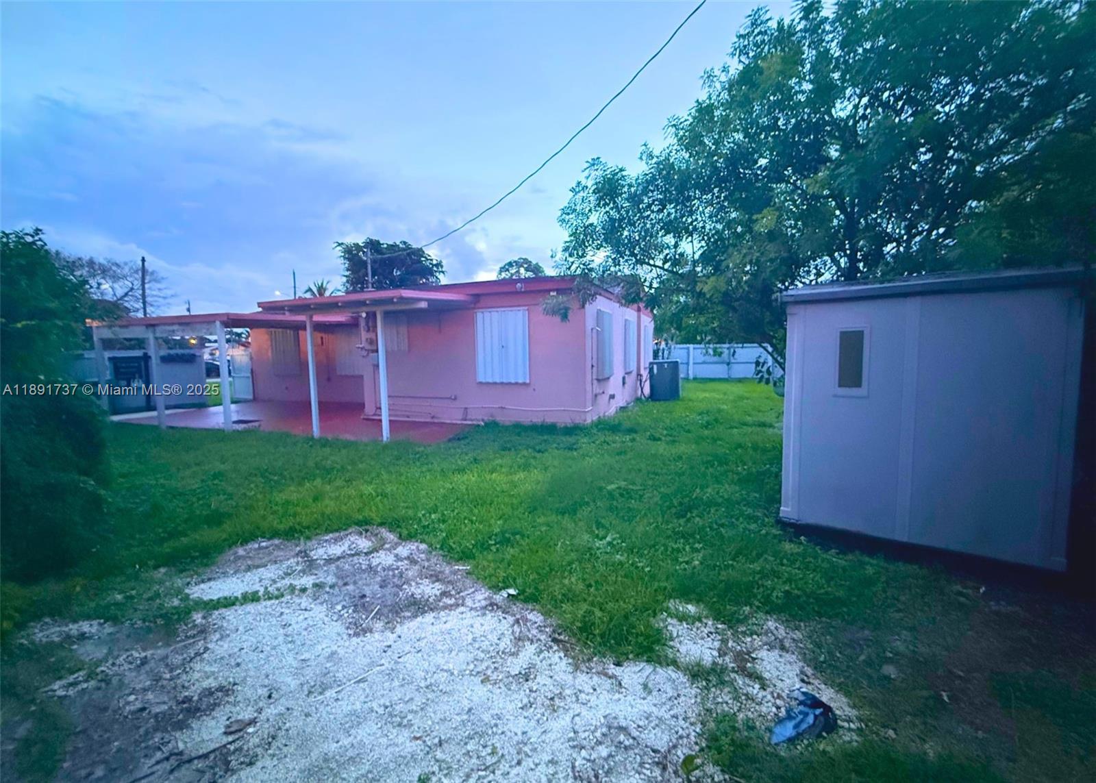 3450 Southwest 75th Court Miami, FL 33155 - Photo 20 of 22 a view of a backyard with potted plants and large trees