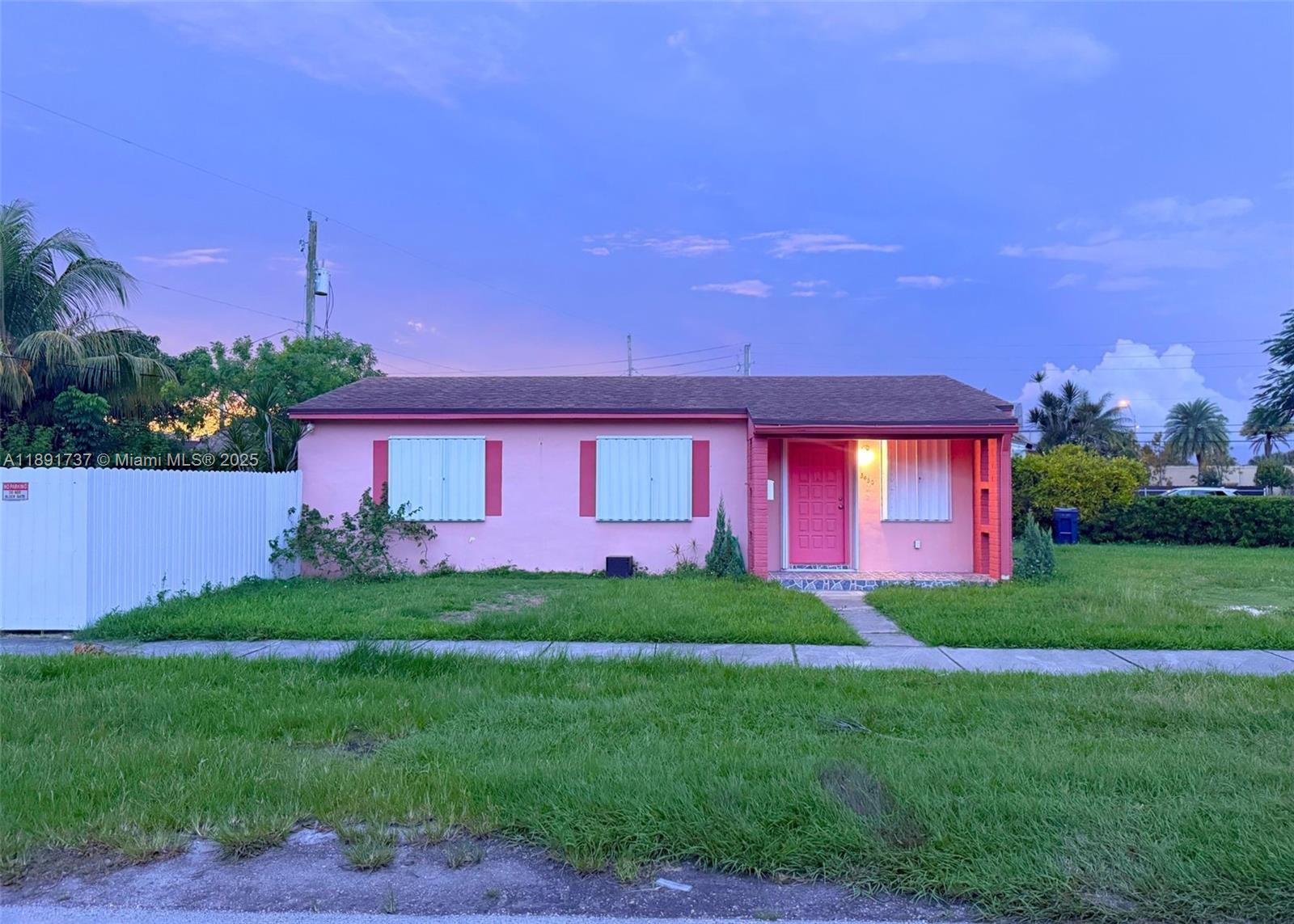 3450 Southwest 75th Court Miami, FL 33155 - Photo 2 of 22 a front view of a house with a yard