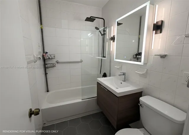 a bathroom with a sink toilet tub and shower