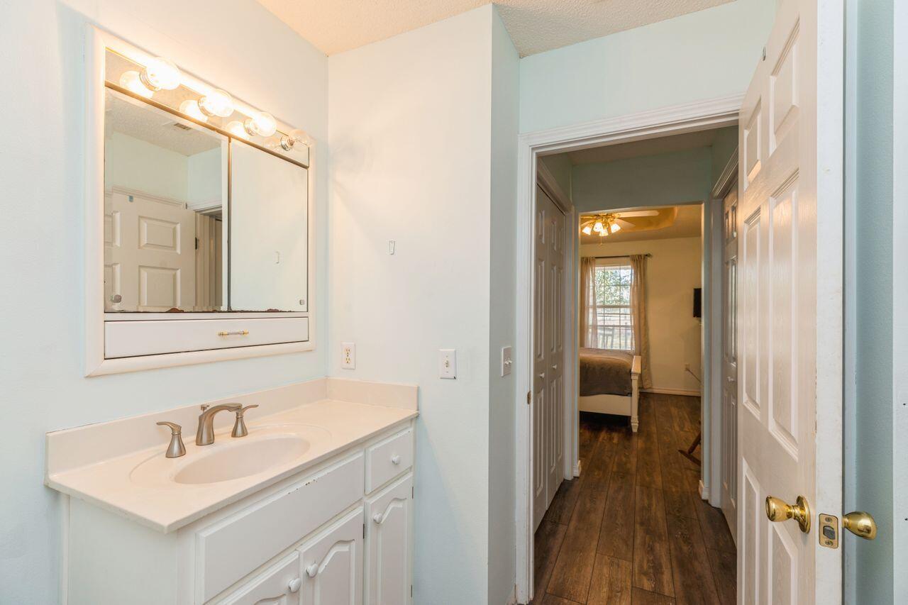 6391 Lumber Ridge Road Crestview, FL 32539 - Photo 16 of 48 a bathroom with a sink and a mirror