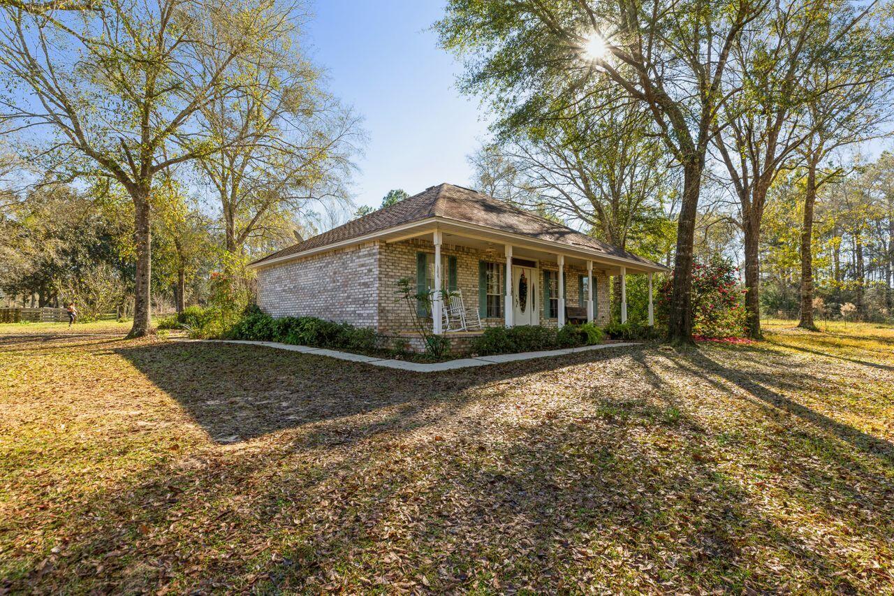 6391 Lumber Ridge Road Crestview, FL 32539 - Photo 2 of 48 a view of a house with a yard