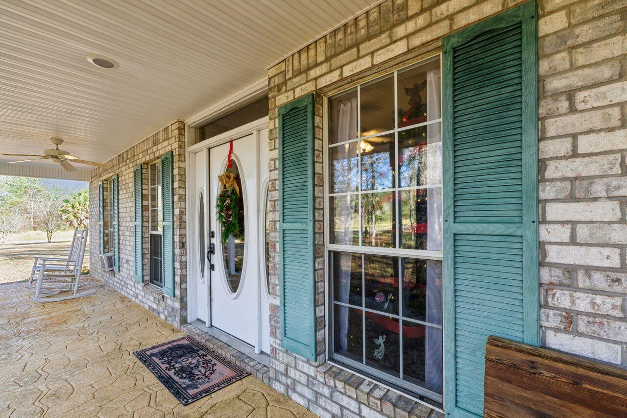 6391 Lumber Ridge Road Crestview, FL 32539 - Photo 3 of 48 a view of front door and porch