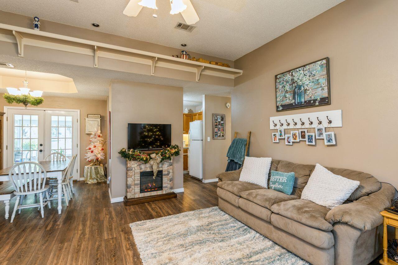 6391 Lumber Ridge Road Crestview, FL 32539 - Photo 4 of 48 a living room with furniture and a flat screen tv