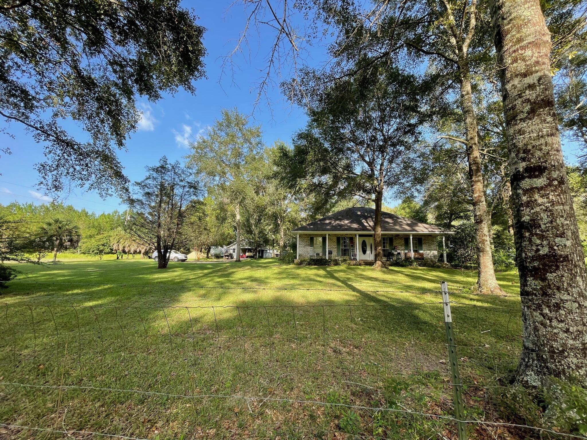 6391 Lumber Ridge Road Crestview, FL 32539 - Photo 41 of 48 a view of a house with a big yard