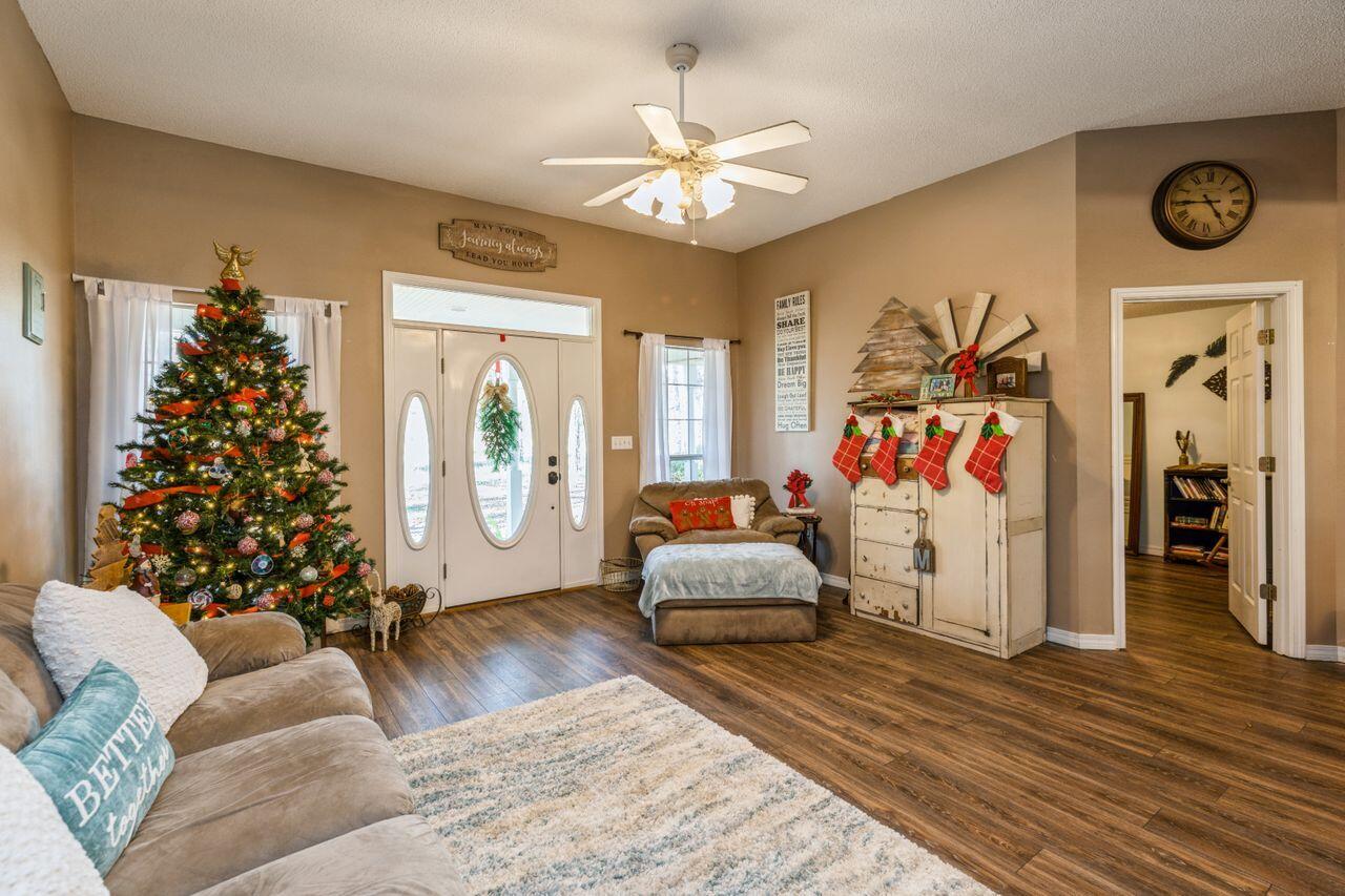 6391 Lumber Ridge Road Crestview, FL 32539 - Photo 5 of 48 a living room with furniture and a large window