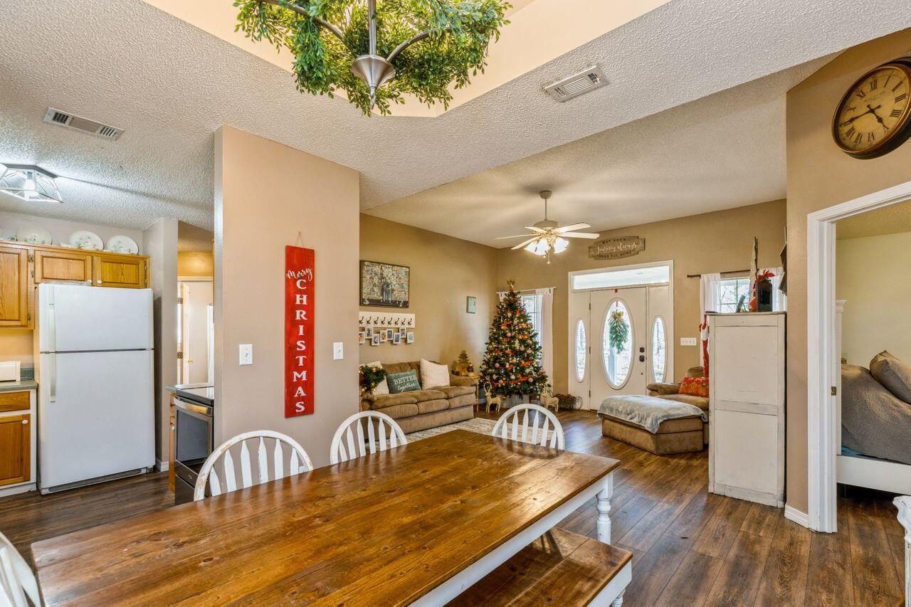 6391 Lumber Ridge Road Crestview, FL 32539 - Photo 9 of 48 a dining room with furniture and wooden floor