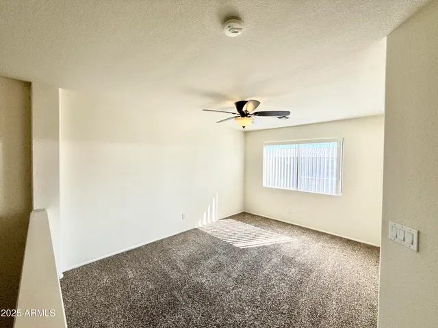 a view of a big room with carpet