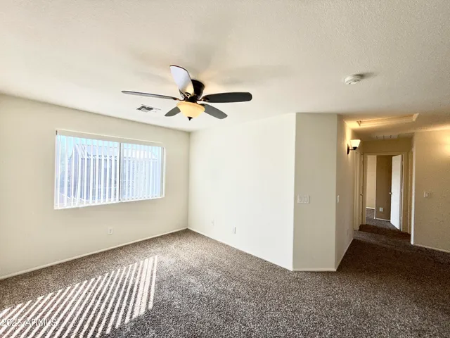 a view of an empty room and window