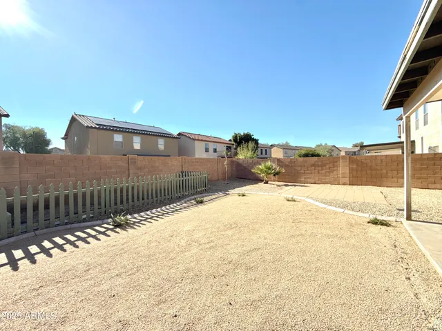 a view of swimming pool next to a yard