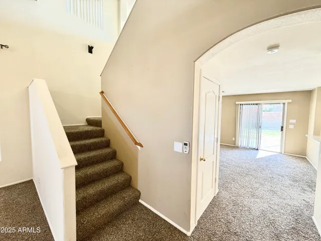 a view of a hallway view with staircase