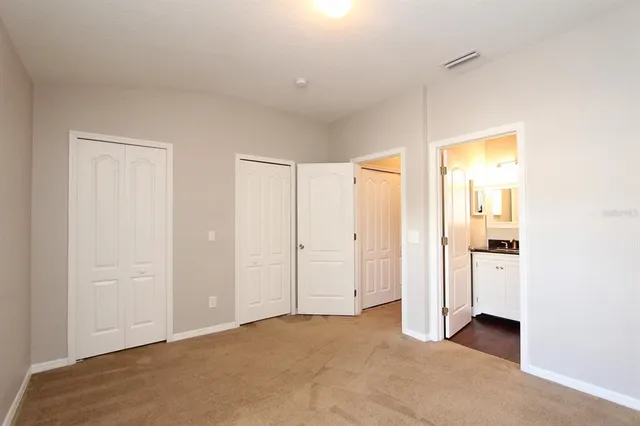 a view of a room that has a bed in it