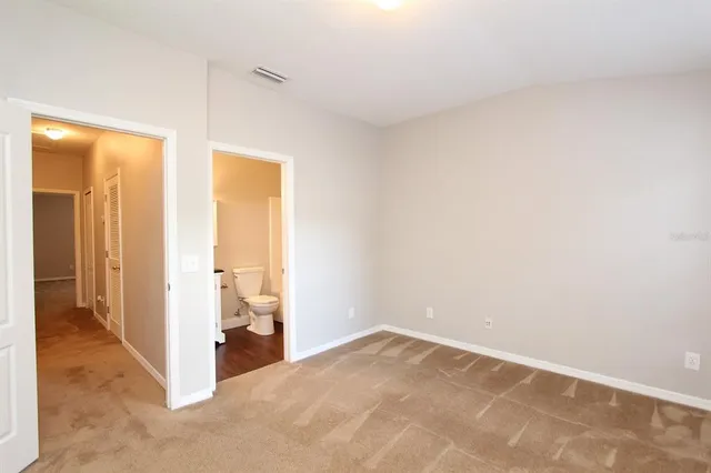a bathroom with a toilet a sink and bathtub