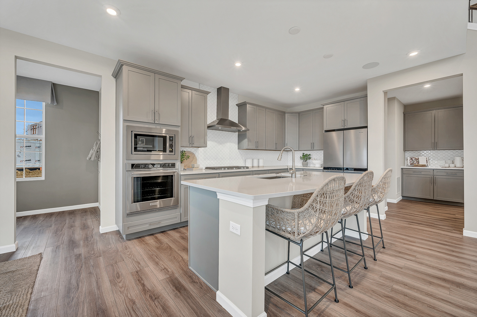 12554 Eileen Street Lemont, IL 60439 - Photo 4 of 17 a kitchen with stainless steel appliances granite countertop a stove top oven a sink dishwasher and a refrigerator with wooden floor