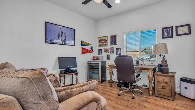 a living room with furniture a couch and a walk in closet