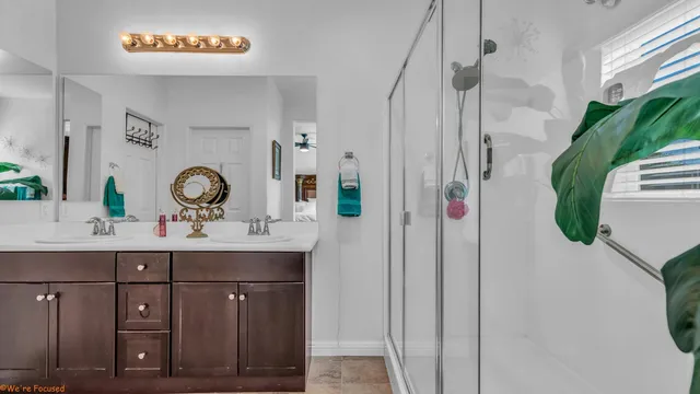 a bedroom with a bed a dresser and chair