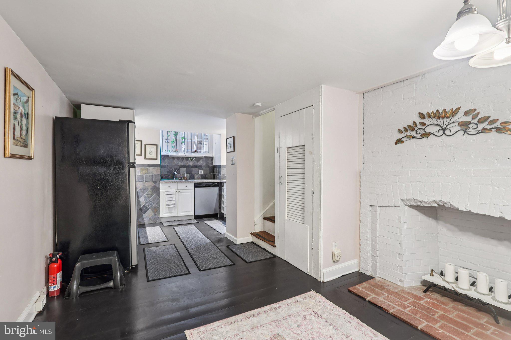 523 South Leithgow Street Philadelphia, PA 19147 - Photo 11 of 35 a kitchen with stainless steel appliances granite countertop a refrigerator and a stove top oven