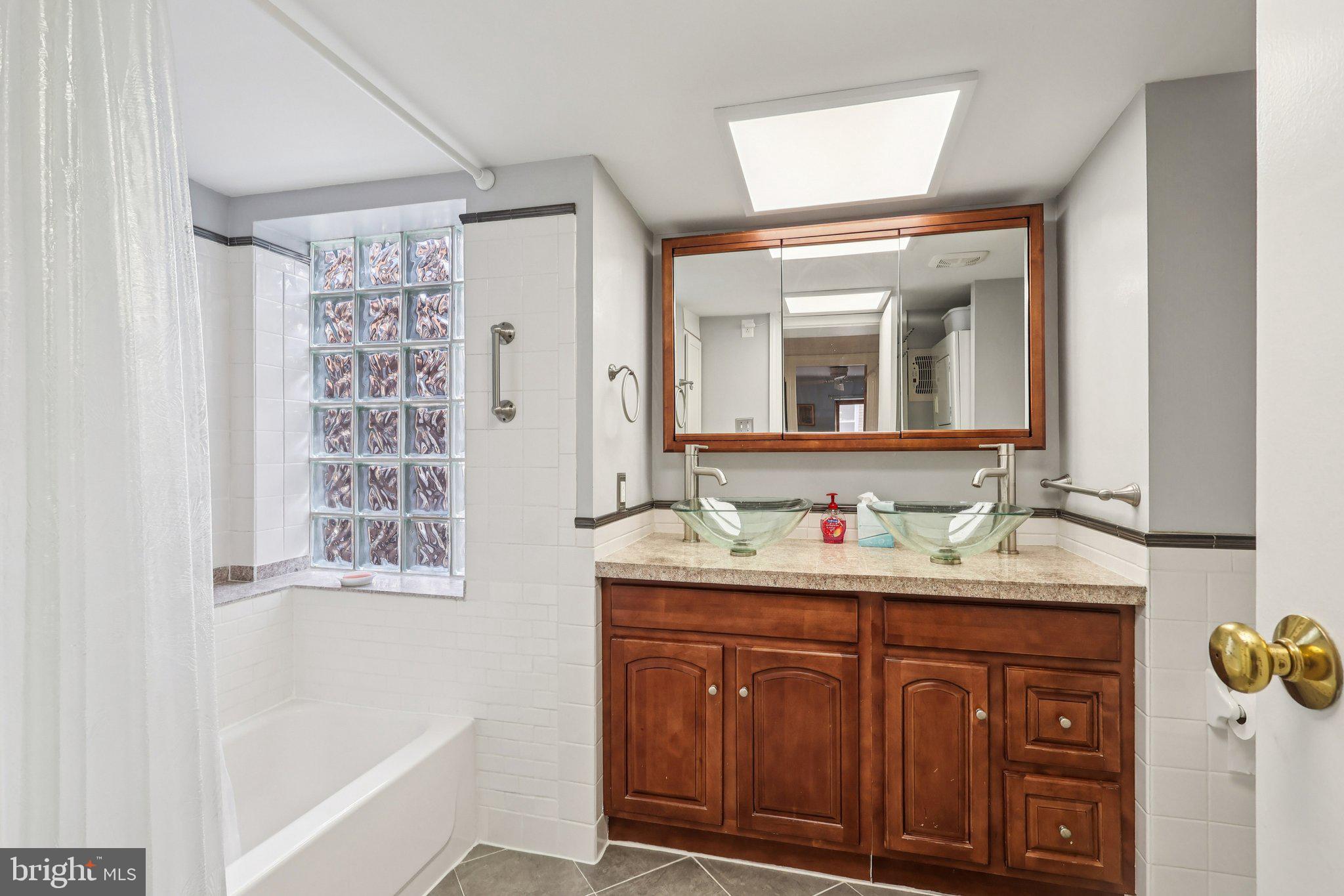 523 South Leithgow Street Philadelphia, PA 19147 - Photo 23 of 35 a bathroom with a sink and a mirror