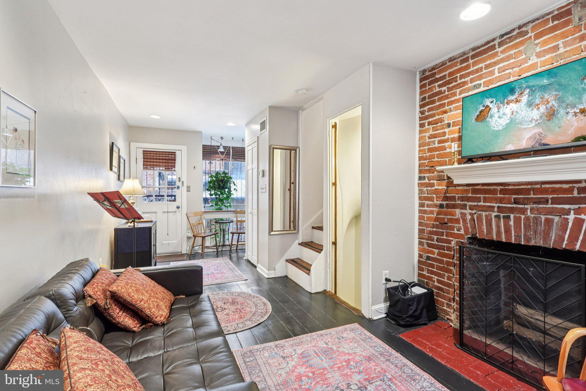 523 South Leithgow Street Philadelphia, PA 19147 - Photo 4 of 35 a living room with furniture and a flat screen tv