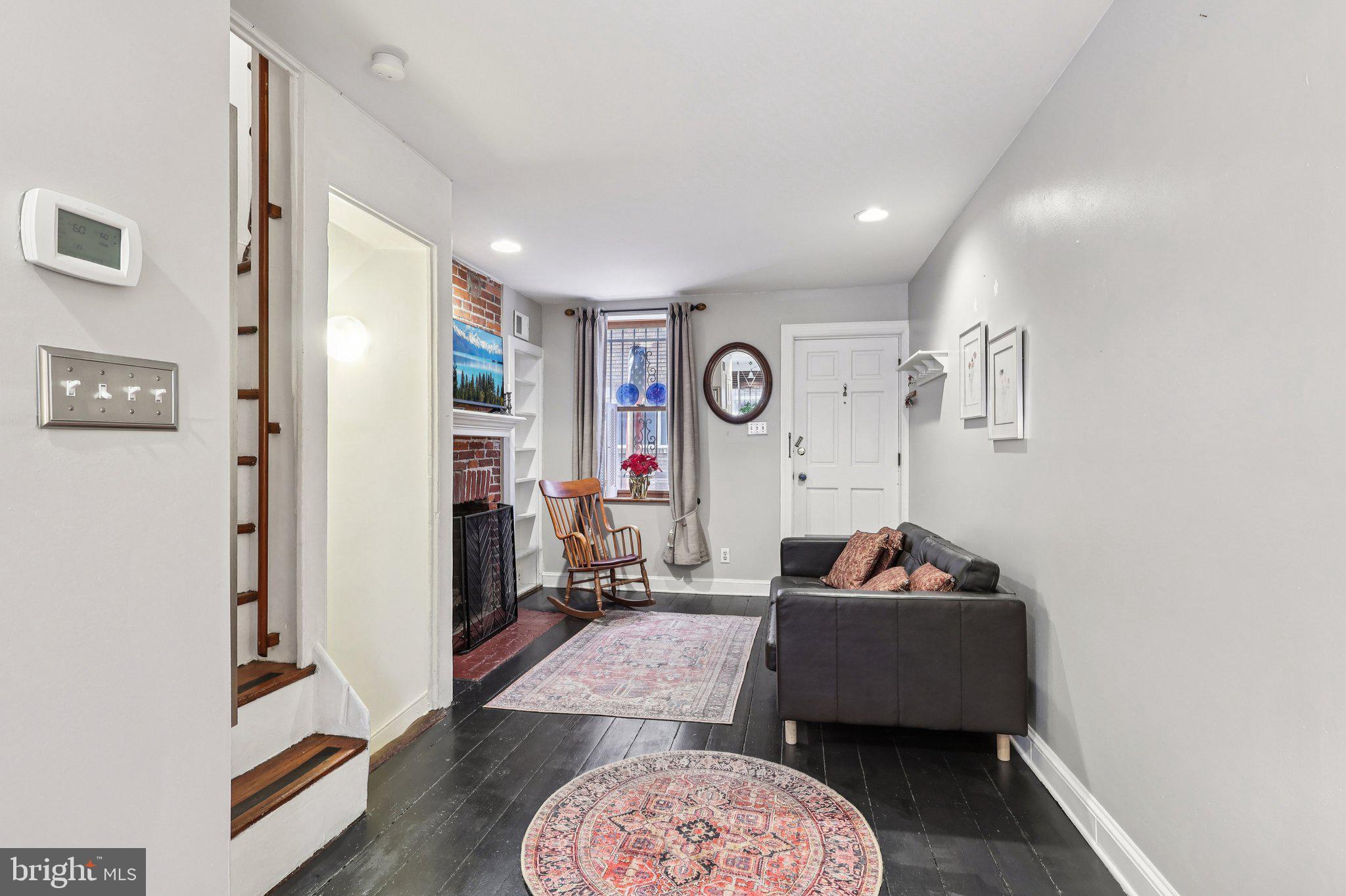 523 South Leithgow Street Philadelphia, PA 19147 - Photo 6 of 35 a living room with furniture and a flat screen tv