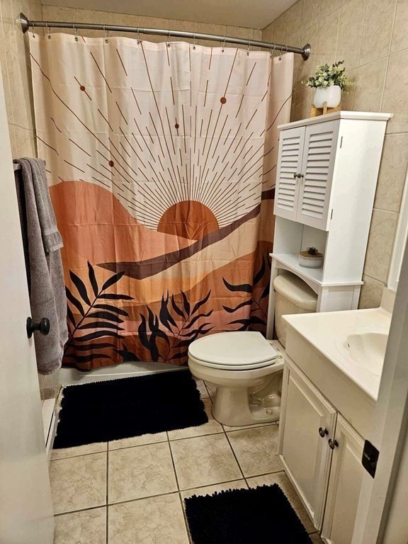 35 Berlin Street, Unit 218 Clinton, MA 01510 - Photo 11 of 13 a bathroom with a toilet and a sink