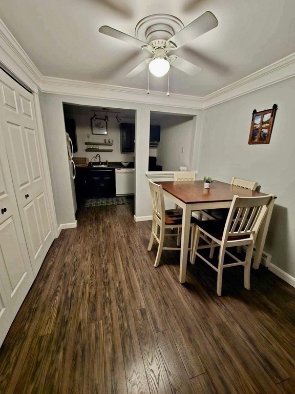 35 Berlin Street, Unit 218 Clinton, MA 01510 - Photo 4 of 13 a view of a dining room with furniture wooden floor and chandelier