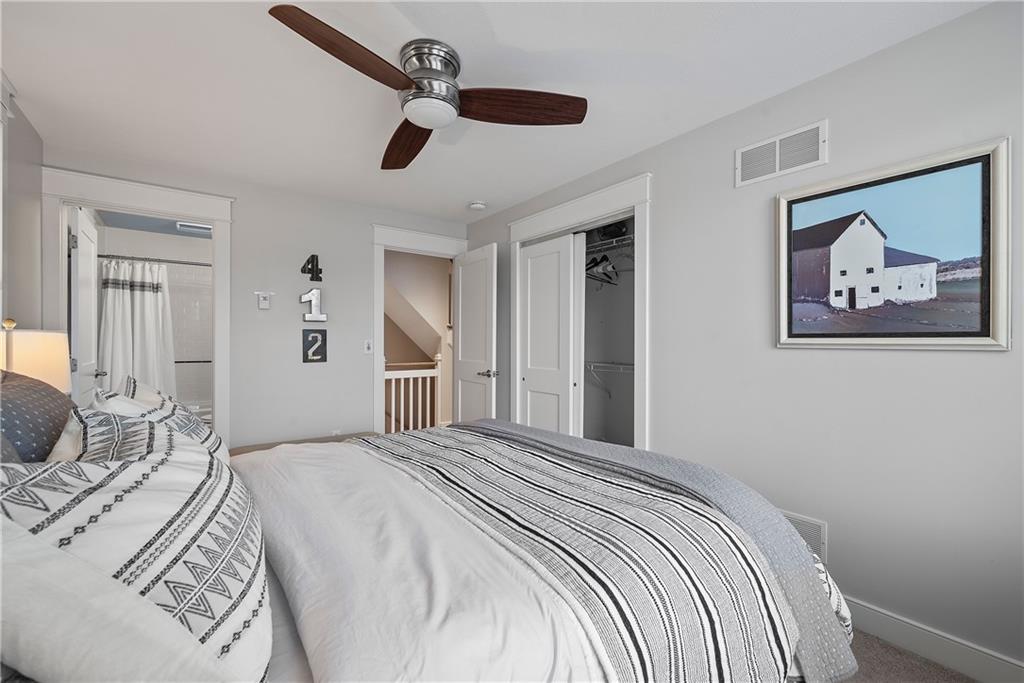 706 Ivy Street, Unit 2 Pittsburgh, PA 15232 - Photo 21 of 35 a bedroom with a large bed and a painting on the wall