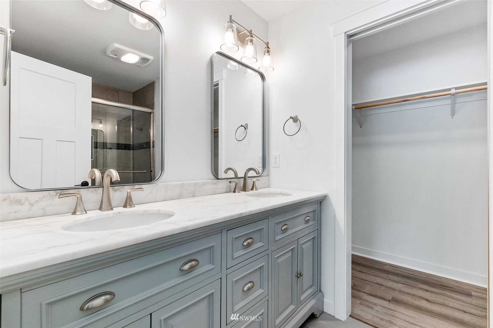 9815 178th Way Southwest Rochester, WA 98579 - Photo 20 of 35 a bathroom with a double vanity sink and mirror