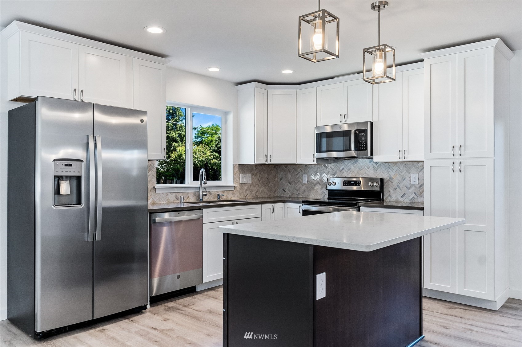 9815 178th Way Southwest Rochester, WA 98579 - Photo 5 of 35 a kitchen with stainless steel appliances granite countertop a refrigerator a stove a sink and a center island
