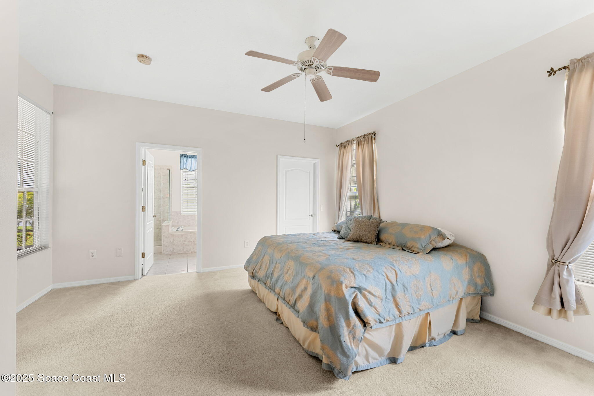 4882 Worthington Circle Rockledge, FL 32955 - Photo 13 of 41 Primary bedroom looking toward bathroom