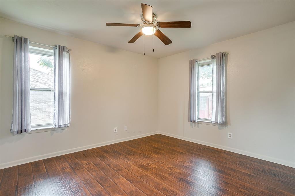 709 North Ave B Springtown, TX 76082 - Photo 15 of 32 a view of empty room with wooden floor and fan