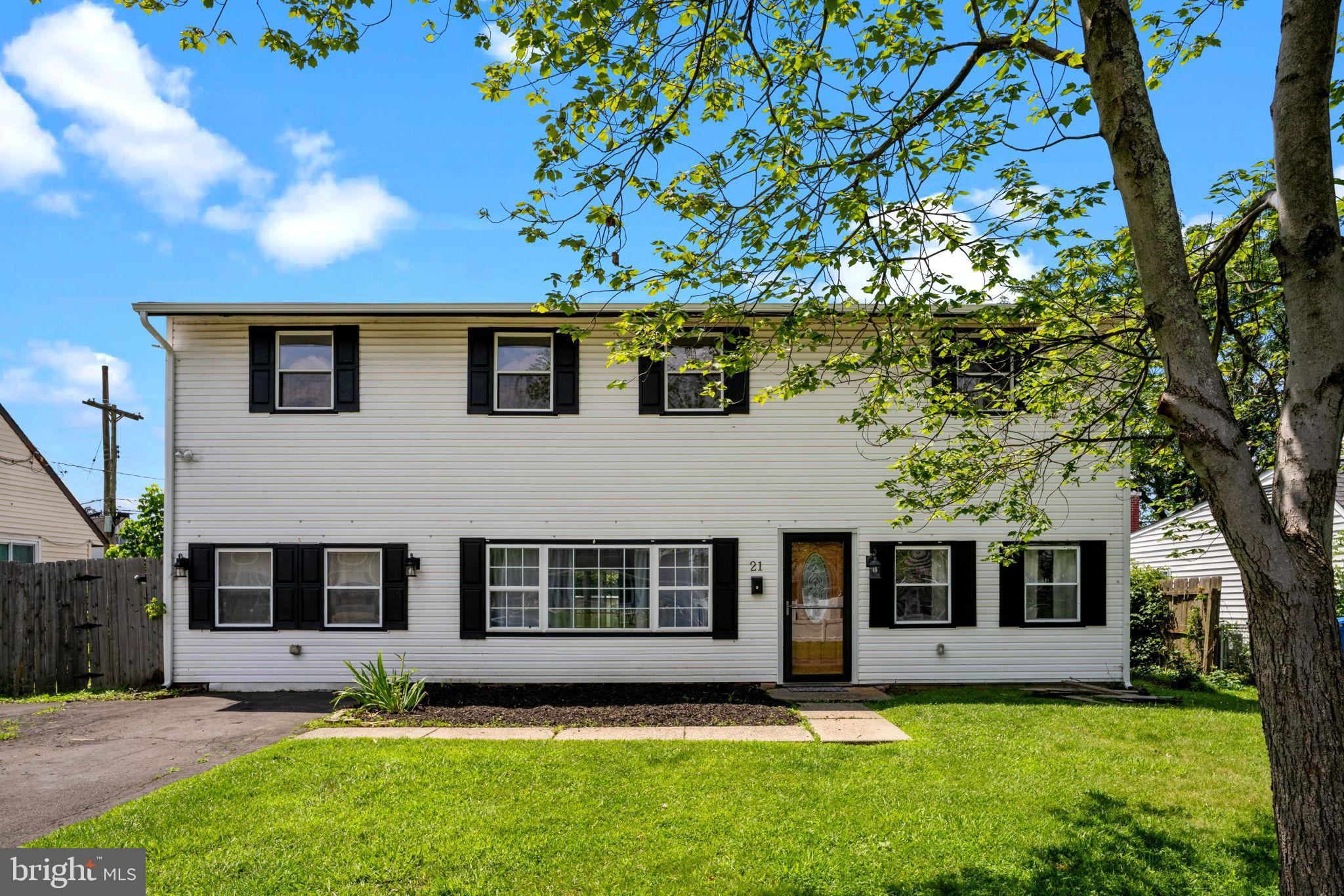 21 Mintleaf Road Levittown, PA 19056 - Photo 1 of 29 Charming two-story home with lush greenery.
