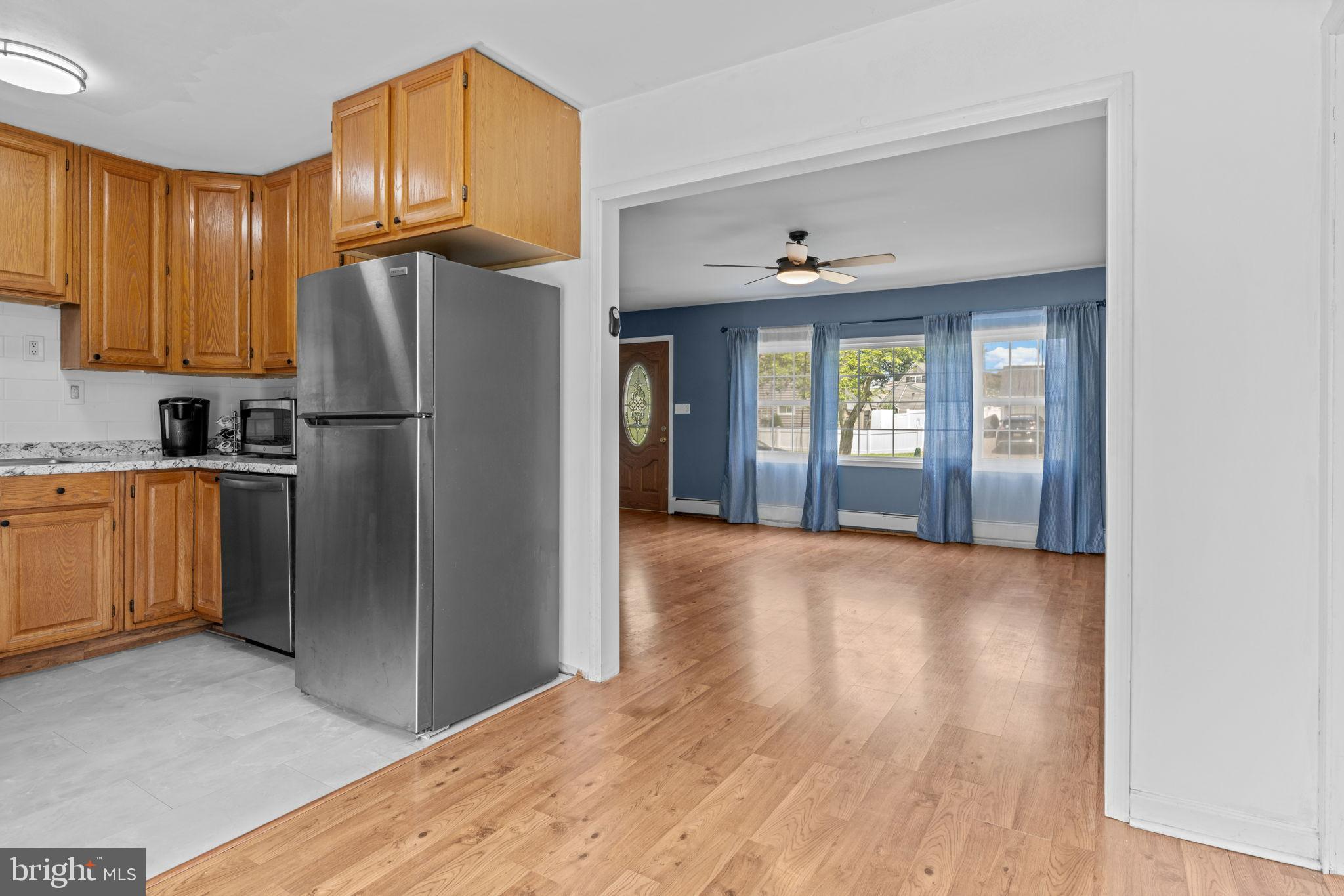 21 Mintleaf Road Levittown, PA 19056 - Photo 8 of 29 Bright and inviting open-concept living space.