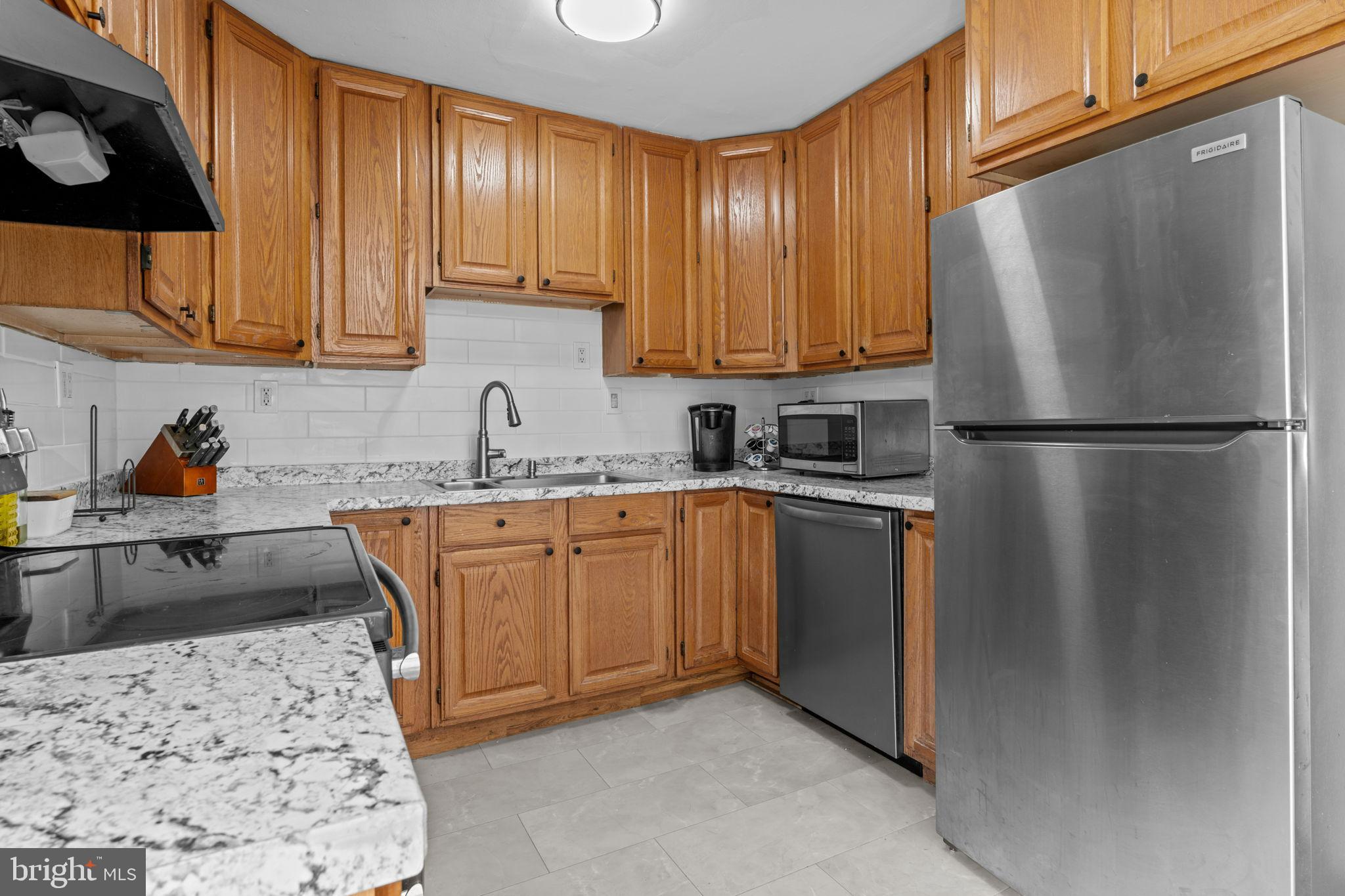 21 Mintleaf Road Levittown, PA 19056 - Photo 9 of 29 Modern kitchen with warm wood accents.