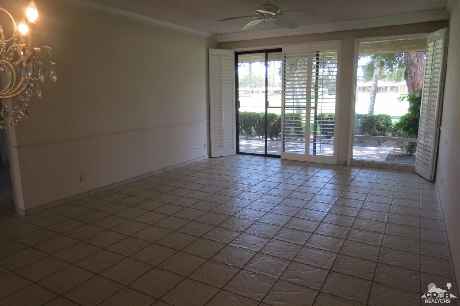 59 La Ronda Drive Rancho Mirage, CA 92270 - Photo 16 of 27 a view of empty room with wooden floor and fan