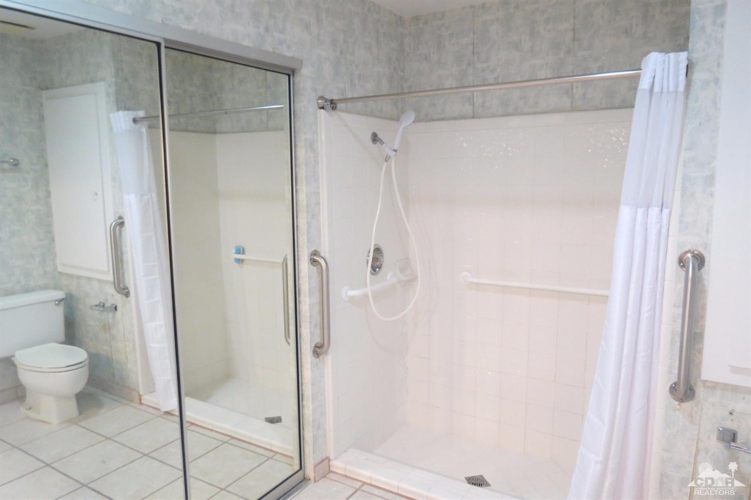 59 La Ronda Drive Rancho Mirage, CA 92270 - Photo 20 of 27 a bathroom with a shower and a toilet