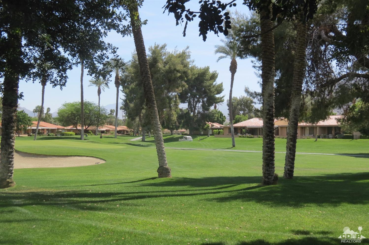 59 La Ronda Drive Rancho Mirage, CA 92270 - Photo 4 of 27 a garden view with a fountain