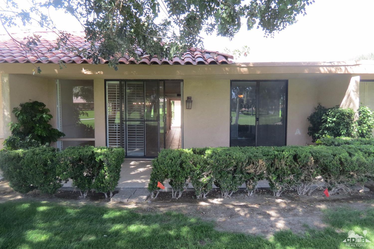 59 La Ronda Drive Rancho Mirage, CA 92270 - Photo 8 of 27 a front view of a house with a porch