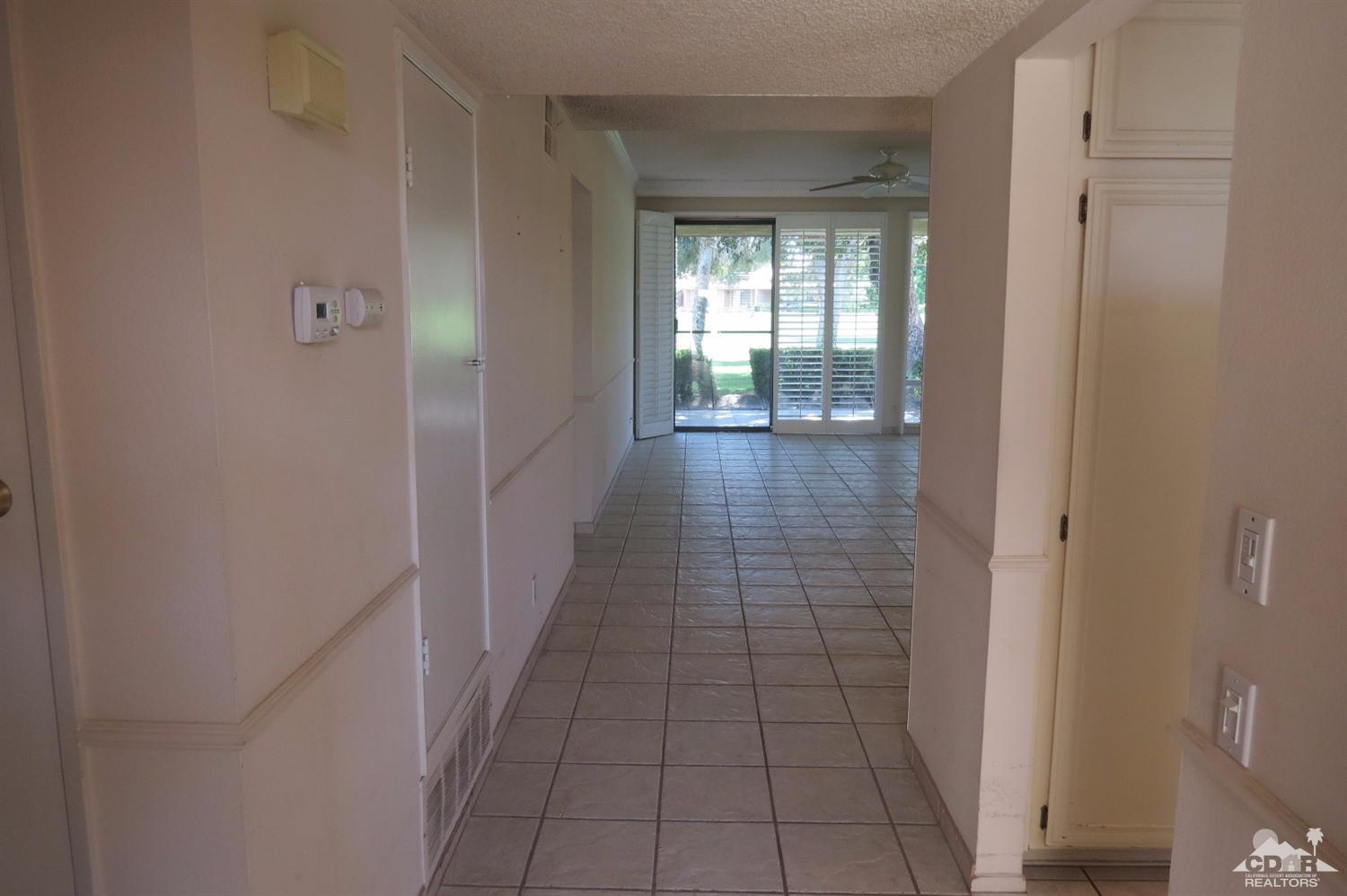 59 La Ronda Drive Rancho Mirage, CA 92270 - Photo 10 of 27 a view of hallway with wooden floor