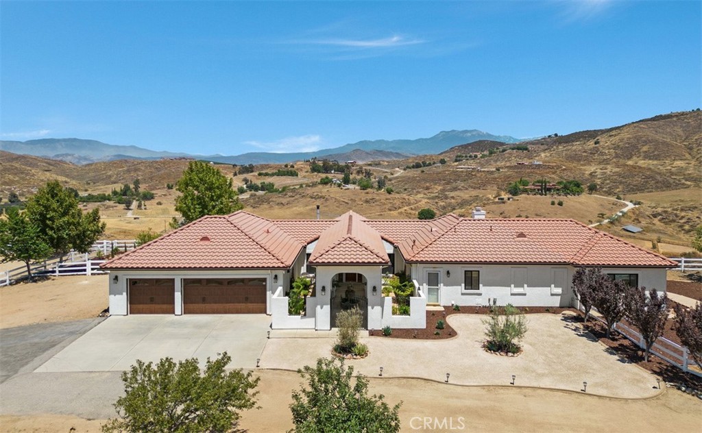 46520 De Portola Road Temecula, CA 92592 - Photo 1 of 1 a front view of a house with a yard