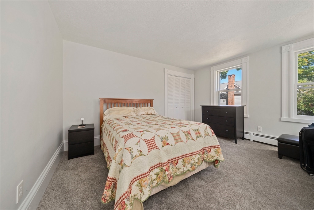 86 High Street Randolph, MA 02368 - Photo 13 of 28 a bedroom with a bed and a window