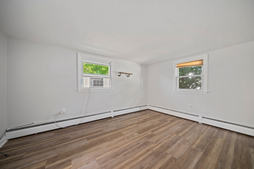 86 High Street Randolph, MA 02368 - Photo 18 of 28 wooden floor in an empty room