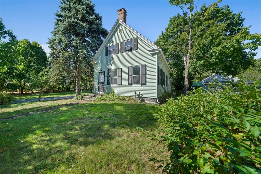 86 High Street Randolph, MA 02368 - Photo 3 of 28 a front view of house with yard and green space
