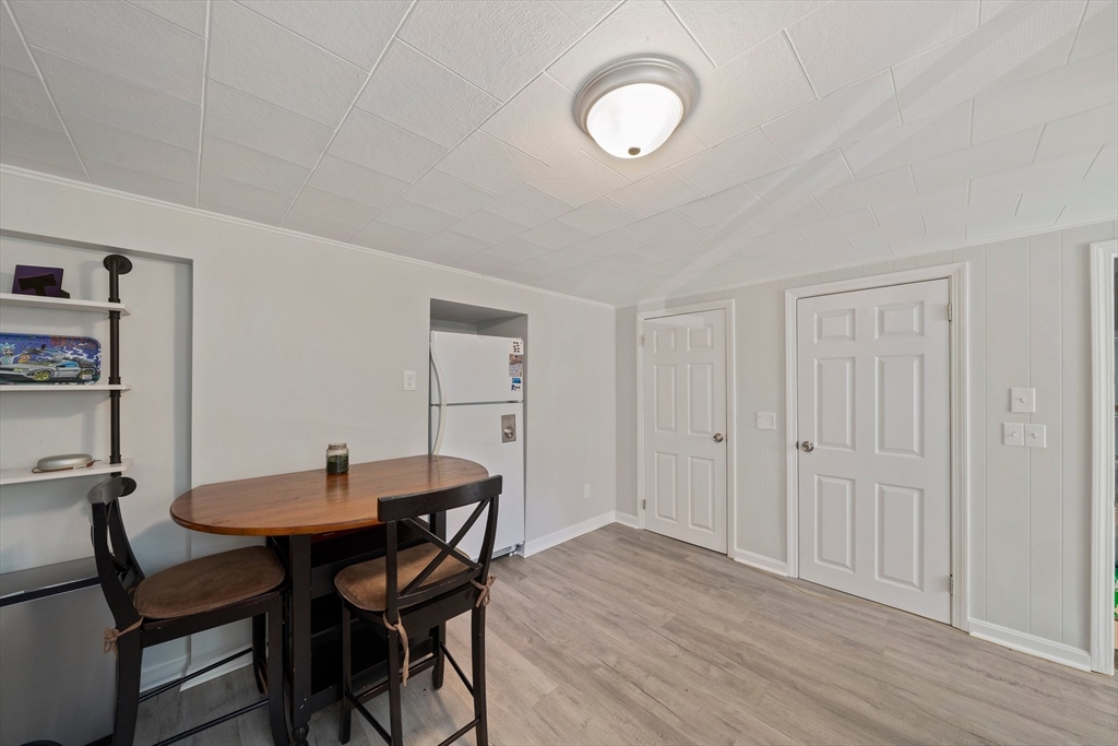86 High Street Randolph, MA 02368 - Photo 6 of 28 a view of a dining room with furniture and wooden floor